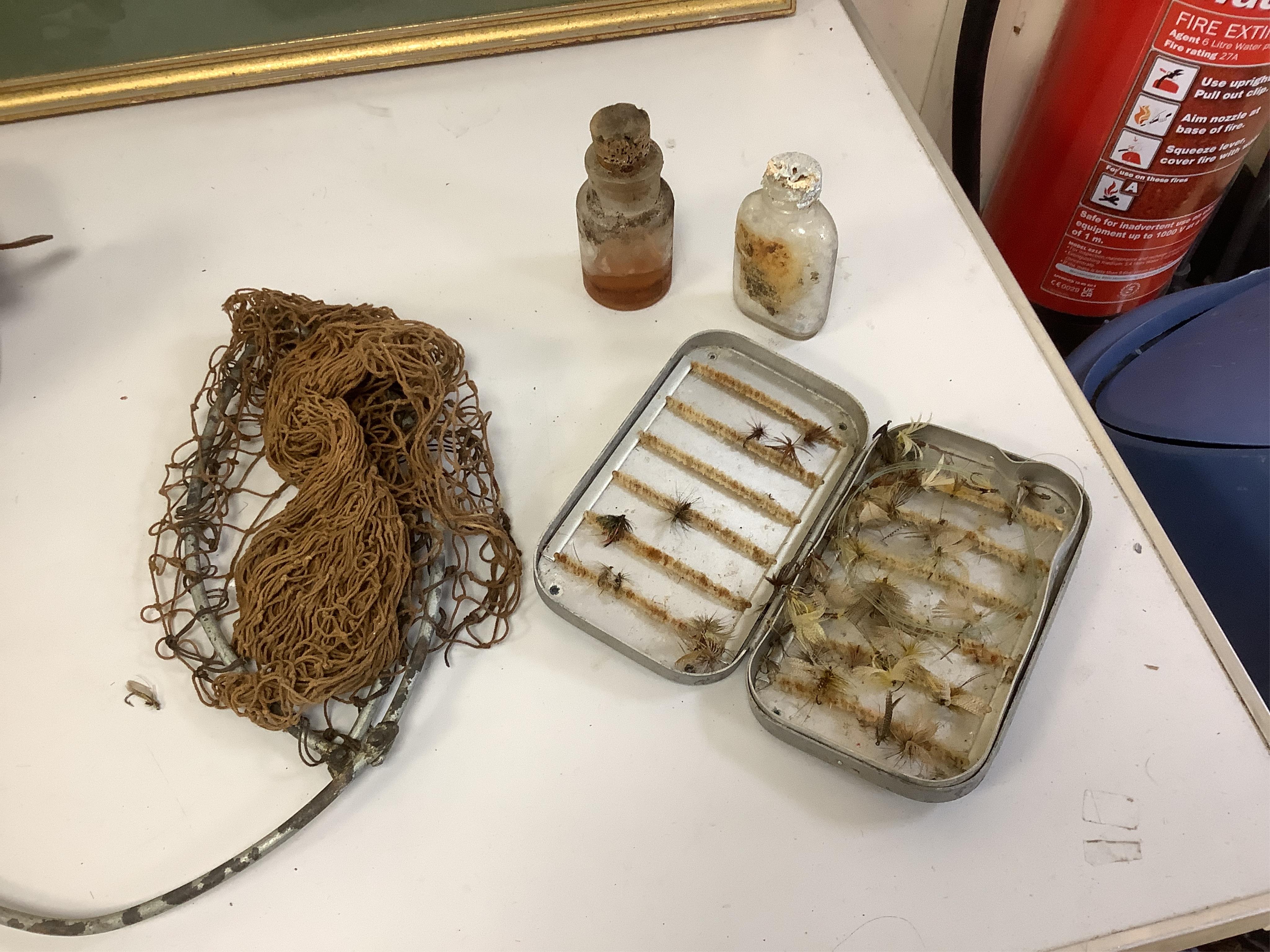 A collection of split cane fishing rods, reels, landing net etc contained in a large wooden box